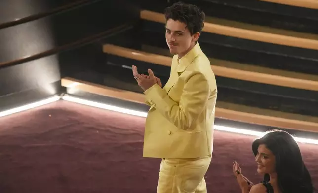 Timothee Chalamet, left, and Kylie Jenner in the audience during the Oscars on Sunday, March 2, 2025, at the Dolby Theatre in Los Angeles. (AP Photo/Chris Pizzello)