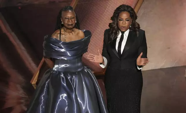 Whoopi Goldberg, left, and Oprah pay tribute to Quincy Jones during the Oscars on Sunday, March 2, 2025, at the Dolby Theatre in Los Angeles. (AP Photo/Chris Pizzello)