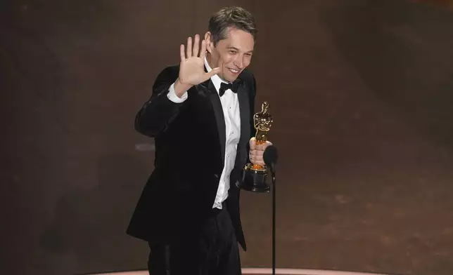 Sean Baker accepts the award for best director for "Anora" during the Oscars on Sunday, March 2, 2025, at the Dolby Theatre in Los Angeles. (AP Photo/Chris Pizzello)