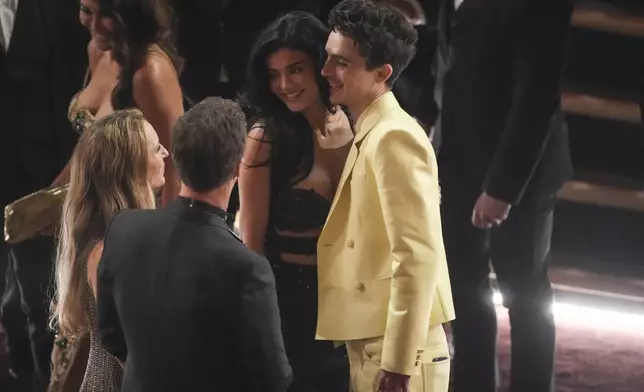 Shauna Robertson, from left, Edward Norton, Kylie Jenner, and Timothee Chalamet in the audience during the Oscars on Sunday, March 2, 2025, at the Dolby Theatre in Los Angeles. (AP Photo/Chris Pizzello)