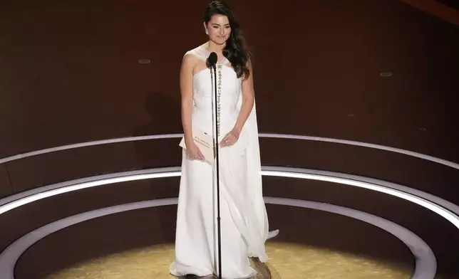 Penelope Cruz presents the award for best international feature film during the Oscars on Sunday, March 2, 2025, at the Dolby Theatre in Los Angeles. (AP Photo/Chris Pizzello)