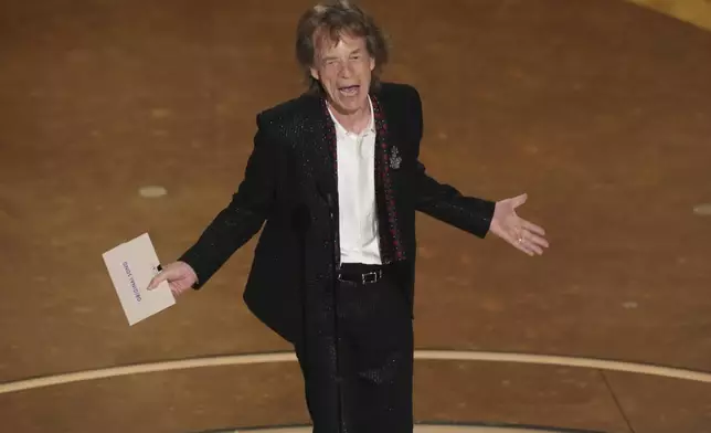 Mick Jagger presents the award for best original song during the Oscars on Sunday, March 2, 2025, at the Dolby Theatre in Los Angeles. (AP Photo/Chris Pizzello)