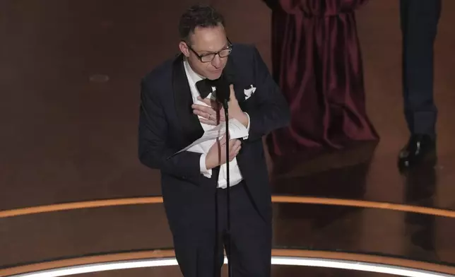 Lol Crawley accepts the award for best cinematography for "The Brutalist" during the Oscars on Sunday, March 2, 2025, at the Dolby Theatre in Los Angeles. (AP Photo/Chris Pizzello)