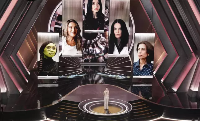 Emma Stone presents the award for best performance by an actress in a leading role during the Oscars on Sunday, March 2, 2025, at the Dolby Theatre in Los Angeles. (AP Photo/Chris Pizzello)