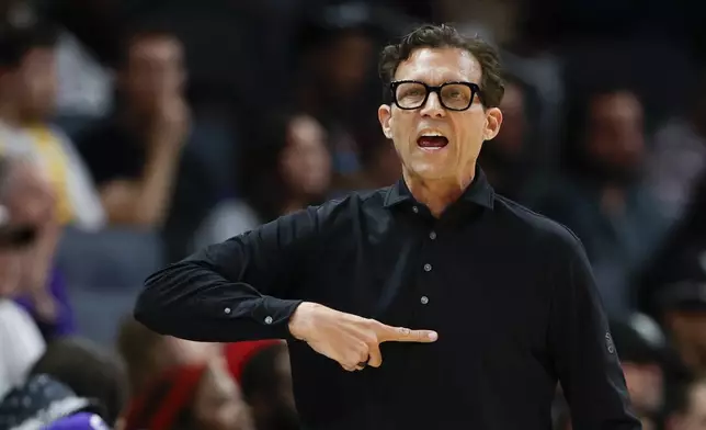 Atlanta Hawks head coach Quin Snyder calls a play during the first half of an NBA basketball game against the Charlotte Hornets in Charlotte, N.C., Tuesday, March 18, 2025. (AP Photo/Nell Redmond)