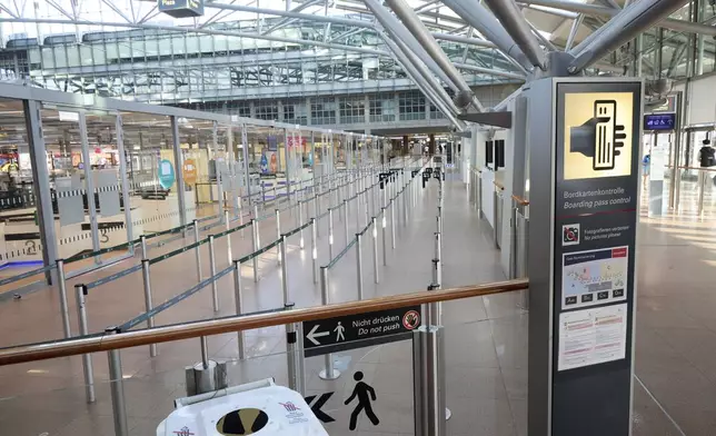 An area in front of the security checkpoints is empty at Hamburg Airport, Germany Sunday, March 9, 2025. (Georg Wendt/dpa via AP)