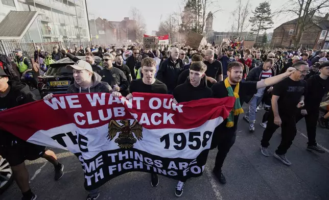 Manchester United fans protest against the club's owners, the Glazer family, prior to the English Premier League soccer match between Manchester United and Arsenal at Old Trafford stadium in Manchester, England, Sunday, March 9, 2025. (AP Photo/Dave Thompson)
