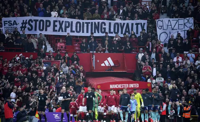 Manchester United fans protest against the club's owners, the Glazer family, prior to the English Premier League soccer match between Manchester United and Arsenal at Old Trafford stadium in Manchester, England, Sunday, March 9, 2025. (AP Photo/Dave Thompson)