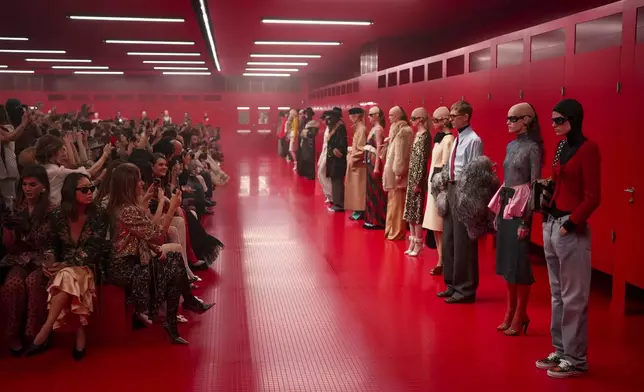 Models wear creations as part of the Valentino Fall/Winter 2025-2026 Womenswear collection presented in Paris, Sunday, March 9, 2025. (Photo by Scott A Garfitt/Invision/AP)