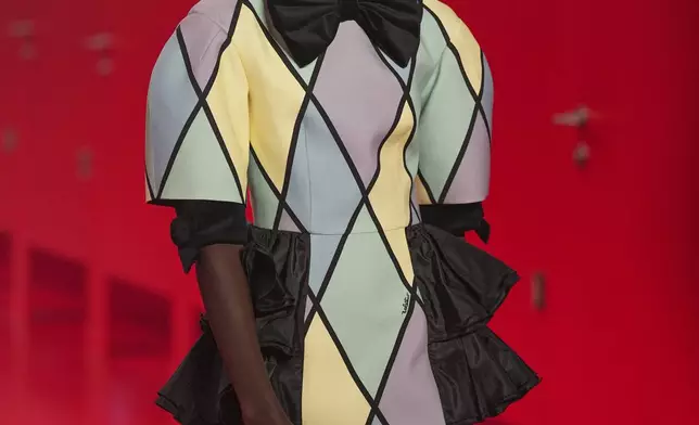A model wears a creation as part of the Valentino Fall/Winter 2025-2026 Womenswear collection presented in Paris, Sunday, March 9, 2025. (Photo by Scott A Garfitt/Invision/AP)