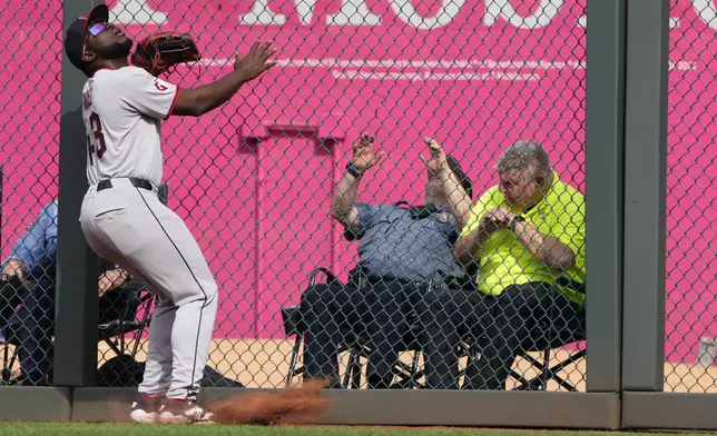 Cleveland Guardians right fielder Jhonkensy Noel watches a three-run home run hit by Kansas City Royals' Vinnie Pasquantino (9) during the third inning of a baseball game Thursday, March 27, 2025, in Kansas City, Mo. (AP Photo/Charlie Riedel)
