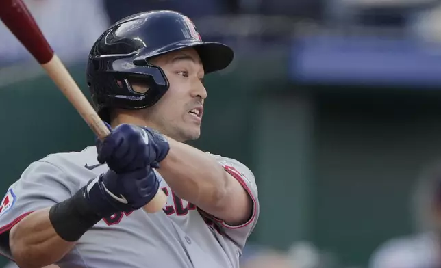 Cleveland Guardians' Steven Kwan watches his RBI double to tie the score during the 10th inning of a baseball game against the Kansas City Royals Thursday, March 27, 2025, in Kansas City, Mo. (AP Photo/Charlie Riedel)