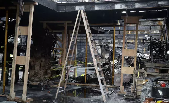 FILE - A ladder stands inside the charred warehouse Tuesday, Dec. 13, 2016, in Oakland, Calif. The fire, which happened on Friday, Dec 2, killed dozens of people during a electronic dance party as it raced through the building, in the deadliest structure fire in the U.S. in more than a decade. (AP Photo/Marcio Jose Sanchez, File)