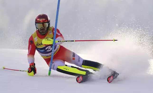 Switzerland's Loic Meillard competes in an alpine ski, men's World Cup slalom, in Kranjska Gora, Slovenia, Sunday, March 2, 2025. (AP Photo/Pier Marco Tacca)