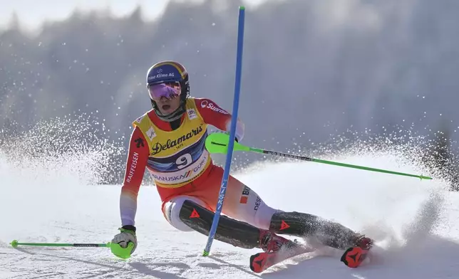 Switzerland's Tanguy Nef competes in an alpine ski, men's World Cup slalom, in Kranjska Gora, Slovenia, Sunday, March 2, 2025. (AP Photo/Pier Marco Tacca)