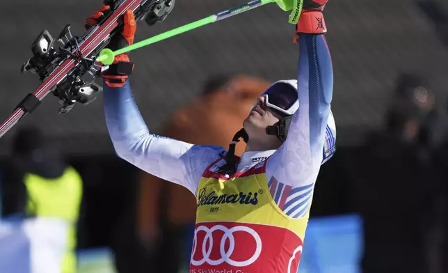 Norway's Henrik Kristoffersen celebrates winning an alpine ski, men's World Cup slalom, in Kranjska Gora, Slovenia, Sunday, March 2, 2025. (AP Photo/Giovanni Auletta)