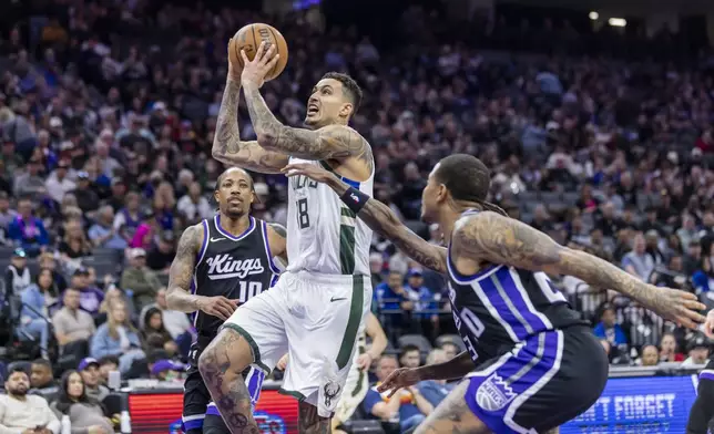 Milwaukee Bucks forward Kyle Kuzma (18) makes a layup during the first half of an NBA basketball game against the Sacramento Kings,Saturday, March 22, 2025, in Sacramento, Calif. (AP Photo/Sara Nevis)