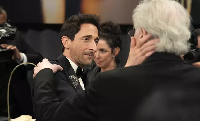 Adrien Brody, left, winner of the award for best performance by an actor in a leading role for "The Brutalist," and Elliot Brody attend the Governors Ball after the Oscars on Sunday, March 2, 2025, in Los Angeles. (AP Photo/John Locher)