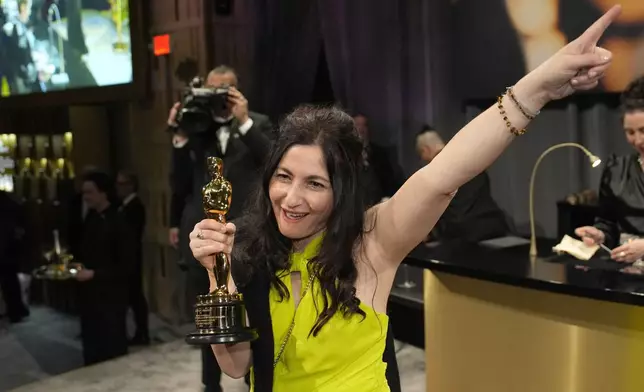 Marilyne Scarselli, winner of the award for best makeup and hairstyling for "The Substance," attend the Governors Ball after the Oscars on Sunday, March 2, 2025, in Los Angeles. (AP Photo/John Locher)