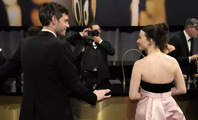 Alex Coco, left, winner of the award for best picture for "Anora," and Mikey Madison, winner of the award for best performance by an actress in a leading role for "Anora," attend the Governors Ball after the Oscars on Sunday, March 2, 2025, in Los Angeles. (AP Photo/John Locher)