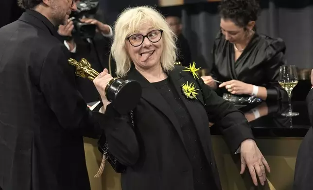Pierre-Olivier Persin, left, and Stephanie Guillon, winners of the award for best makeup and hairstyling for "The Substance," attend the Governors Ball after the Oscars on Sunday, March 2, 2025, in Los Angeles. (AP Photo/John Locher)