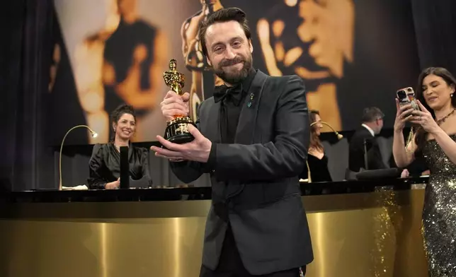 Kieran Culkin, winner of the award for best performance by an actor in a supporting role for "A Real Pain," attends the Governors Ball after the Oscars on Sunday, March 2, 2025, in Los Angeles. (AP Photo/John Locher)