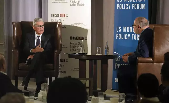Federal Reserve Chair Jerome Powell, left, and Anil Kashyap, Professor of Economics and Finance at the University of Chicago's Booth School of Business, talk after Powell's address to the annual U.S. Monetary Policy Forum, in New York, Friday, March 7, 2025. (AP Photo/Richard Drew),