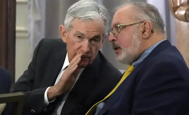Federal Reserve Chair Jerome Powell, left, talks with Anil Kashyap, Professor of Economics and Finance at the University of Chicago's Booth School of Business,, before his address to the annual U.S. Monetary Policy Forum, in New York, Friday, March 7, 2025. (AP Photo/Richard Drew)