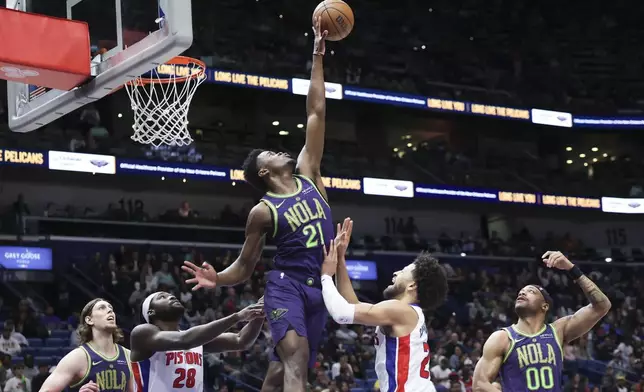 New Orleans Pelicans center Yves Missi (21) blocks a shot by Detroit Pistons guard Cade Cunningham (2) in the second half of an NBA basketball game in New Orleans, Monday, March 17, 2025. (AP Photo/Peter Forest)