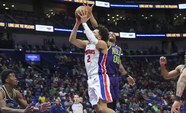 Detroit Pistons guard Cade Cunningham (2) shoots a jumper against New Orleans Pelicans forward Bruce Brown (00) in the second half of an NBA basketball game in New Orleans, Monday, March 17, 2025. (AP Photo/Peter Forest)