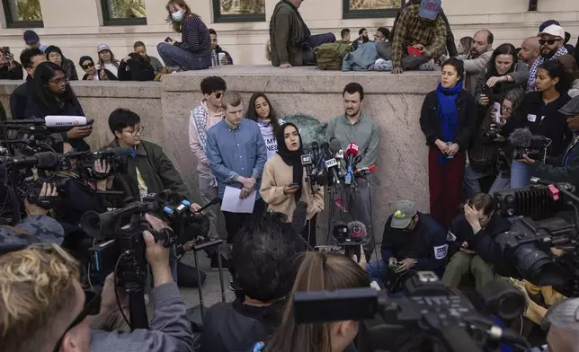 FILE - Mahmoud Khalil, center right, listens as members of the student protest negotiation team speak during a press conference near the pro-Palestinian demonstration encampment at the Columbia University, Friday, April 26, 2024, in New York. (AP Photo/Yuki Iwamura, File)