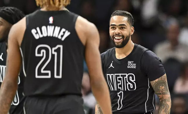 Brooklyn Nets guard D'Angelo Russell (1) smiles during the first half of an NBA basketball game against the Charlotte Hornets, Saturday, March 8, 2025, in Charlotte, N.C. (AP Photo/Matt Kelley)