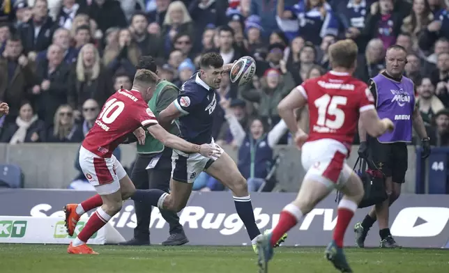 Scotland's Blair Kinghorn scores their side's first try of the game during the Men's Six Nations rugby union match between Scotland and Wales the Murrayfield Stadium, Edinburgh, Saturday, March 8, 2025. (Jane Barlow/PA via AP)
