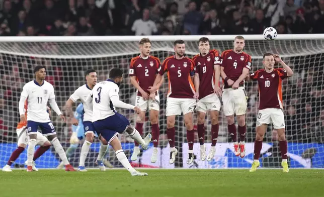 England's Reece James scores scores his side's opening goal during a World Cup qualifying soccer match between England and Latvia at Wembley stadium in London, Monday, March 24, 2025. (John Walton, PA via AP)
