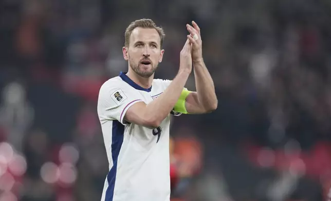 England's Harry Kane applauds fans at the end of a World Cup qualifying soccer match between England and Latvia at Wembley stadium in London, Monday, March 24, 2025. (AP Photo/Kin Cheung)