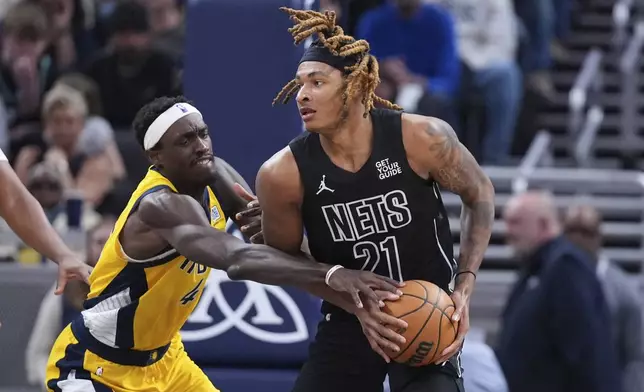 Indiana Pacers forward Pascal Siakam (43) defends Brooklyn Nets forward Noah Clowney (21) during the second half of an NBA basketball game in Indianapolis, Thursday, March 20, 2025. (AP Photo/Michael Conroy)