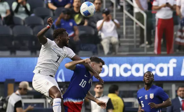 Panama's Jose Rodriguez Francis, left, vies for the ball against United States' Christian Pulisic (10) during the first half of a CONCACAF Nations League semifinal soccer match Thursday, March 20, 2025, in Inglewood, Calif. (AP Photo/Etienne Laurent)