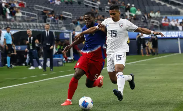 United States' Yunus Musah, left, vies for the ball against Panama's Jorge Gutierrez Cornejo (15) during the first half of a CONCACAF Nations League semifinal soccer match Thursday, March 20, 2025, in Inglewood, Calif. (AP Photo/Etienne Laurent)