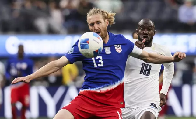 United States' Timothy Ream, left, controls the ball away from Panama's Cecilio Waterman Ruiz during the second half of a CONCACAF Nations League semifinal soccer match Thursday, March 20, 2025, in Inglewood, Calif. (AP Photo/Etienne Laurent)