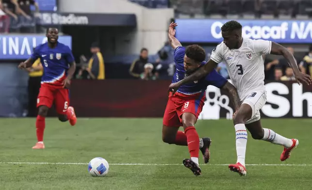United States' Weston Mc Kennie, second from right, vies for the ball against Panama's Jose Cordoba Chambers (3) during the first half of a CONCACAF Nations League semifinal soccer match Thursday, March 20, 2025, in Inglewood, Calif. (AP Photo/Etienne Laurent)