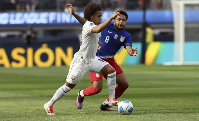 Panama's Adalberto Carrasquilla Alcazar, left, dribbles past United States' Weston Mc Kennie (8) during the first half of a CONCACAF Nations League semifinal soccer match Thursday, March 20, 2025, in Inglewood, Calif. (AP Photo/Etienne Laurent)