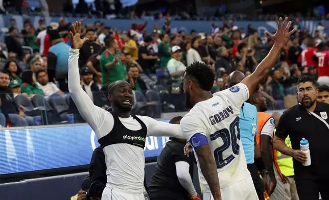Panama's Cecilio Waterman Ruiz, left, celebrates with Panama's Anibal Godoy Lemus after he scored against the United States during the second half of a CONCACAF Nations League semifinal soccer match Thursday, March 20, 2025, in Inglewood, Calif. (AP Photo/Etienne Laurent)