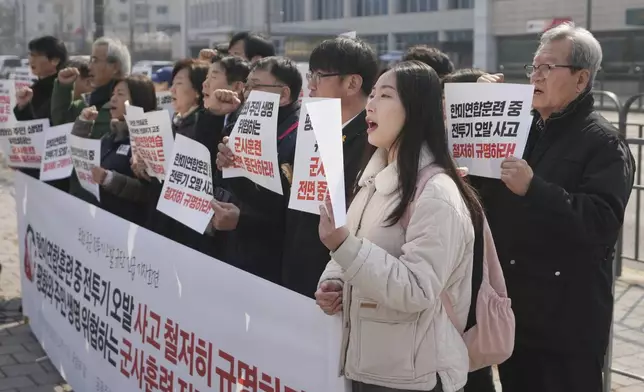 Protesters shout slogans during a press conference demanding to stop the upcoming Freedom Shield military exercise between the U.S. and South Korea and also demanding to investigate the cause thoroughly about fighter jets accidentally dropped eight bombs on a civilian area, in Seoul, South Korea, Friday, March 7, 2025. A banner reads "Stop the Freedom Shield military exercise between the U.S. and South Korea and Demand to Investigate the cause thoroughly about fighter jets accidentally dropped eight bombs." (AP Photo/Lee Jin-man)