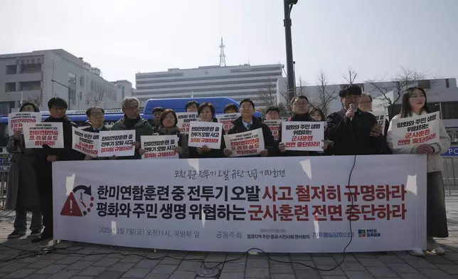 Protesters attend a press conference demanding to stop the upcoming Freedom Shield military exercise between the U.S. and South Korea and also demanding to investigate the cause thoroughly about fighter jets accidentally dropped eight bombs on a civilian area, in Seoul, South Korea, Friday, March 7, 2025. A banner reads "Stop the Freedom Shield military exercise between the U.S. and South Korea and Demand to Investigate the cause thoroughly about fighter jets accidentally dropped eight bombs." (AP Photo/Lee Jin-man)