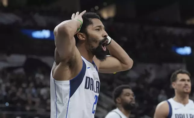 Dallas Mavericks guard Spencer Dinwiddie (26) reacts to a call during the second half of an NBA basketball game against the San Antonio Spurs in San Antonio, Monday, March 10, 2025. (AP Photo/Eric Gay)
