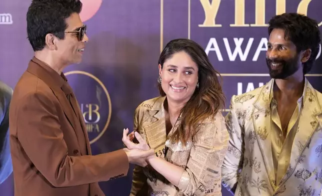 Bollywood personalities Karan Johar, left, and Kareena Kapoor Khan share a lighter moment as actor Shahid Kapoor, right, looks on, on the first day of the International Indian Film Academy (IIFA) awards in Jaipur, India, Saturday, March 8, 2025. (AP Photo/Deepak Sharma)