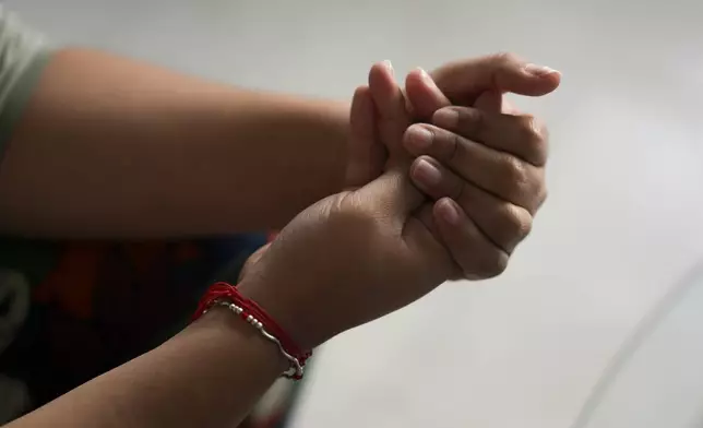 A person gives testimony at Casa Frida, a shelter that supports LGBTQ+ migrants, in Mexico City, Tuesday, Feb. 18, 2025. (AP Photo/Eduardo Verdugo)