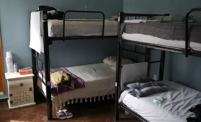 Bunk beds lie in a room at Casa Frida, a shelter that supports LGBTQ+ migrants, in Mexico City, Tuesday, Feb. 18, 2025. (AP Photo/Eduardo Verdugo)