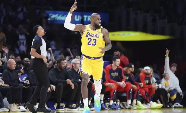 Los Angeles Lakers forward LeBron James celebrates after making a 3-point basket to go over the 50,000 career point mark during the first half of an NBA basketball game against the New Orleans Pelicans, Tuesday, March 4, 2025, in Los Angeles. (AP Photo/Jae C. Hong)