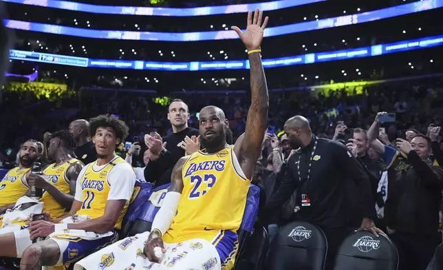 Los Angeles Lakers forward LeBron James waves to the crowd after making a 3-point basket to go over the 50,000 career point mark during the first half of an NBA basketball game against the New Orleans Pelicans, Tuesday, March 4, 2025, in Los Angeles. (AP Photo/Jae C. Hong)